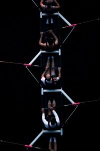 five men riding row boat